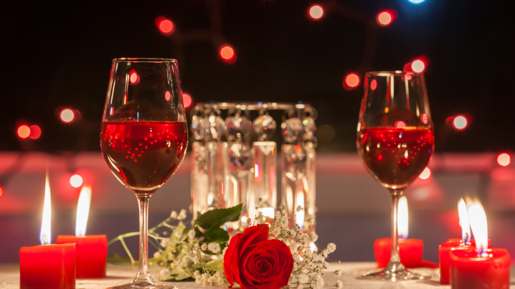 wine glasses on a set table with candles