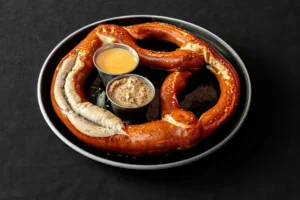 Giant New York Pretzel served with mustard and beer cheese sauce.