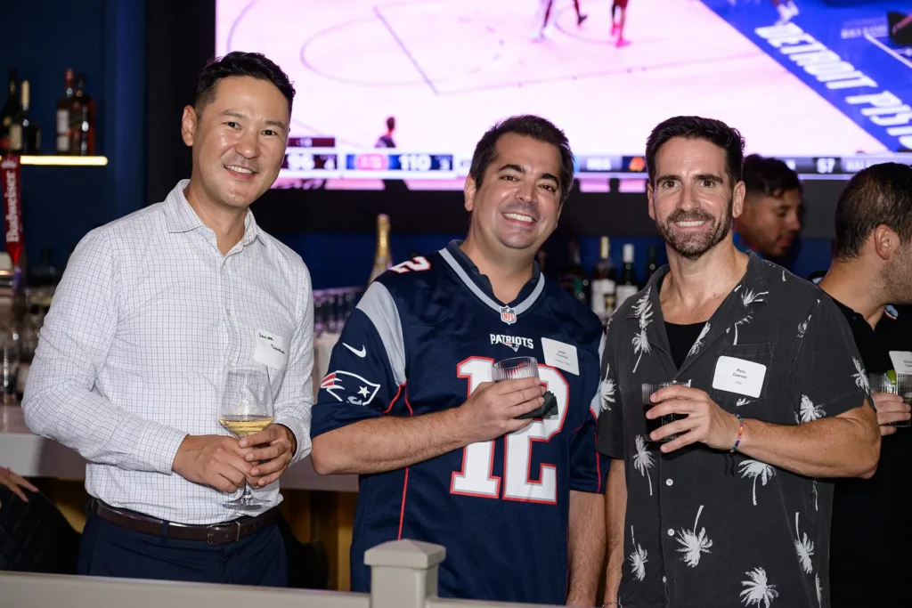 Guests posing during a football viewing party at Planet Hollywood NYC